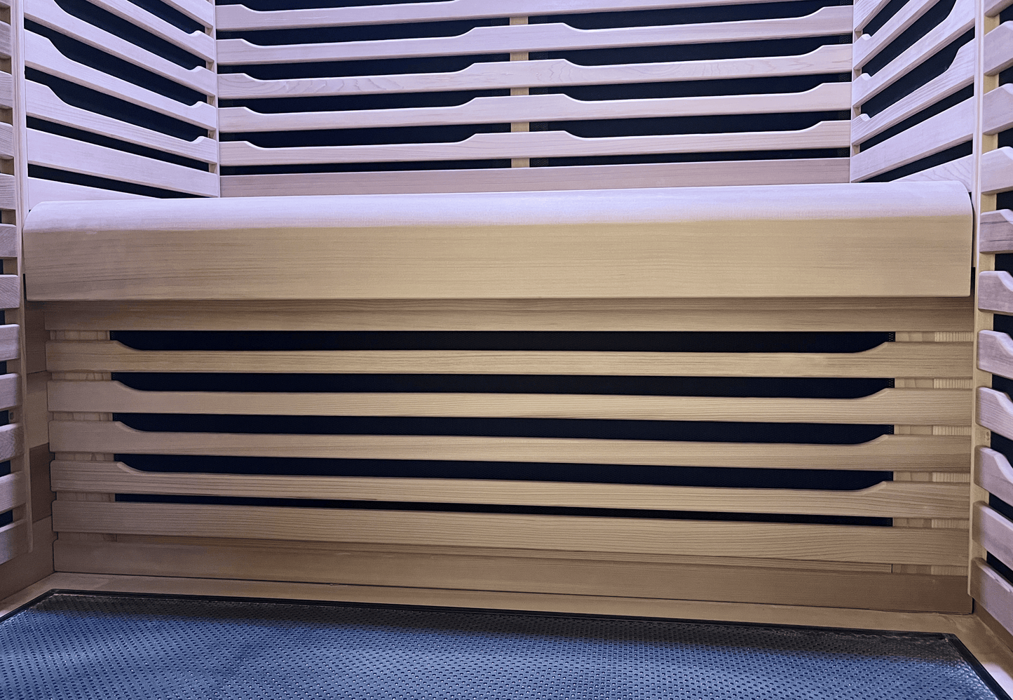 Under-bench view of Canadian Red Cedar wood in a Nook 2-person sauna