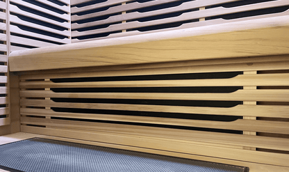 Under-bench view of Canadian Red Cedar wood in a Nook Ultra 3-person sauna
