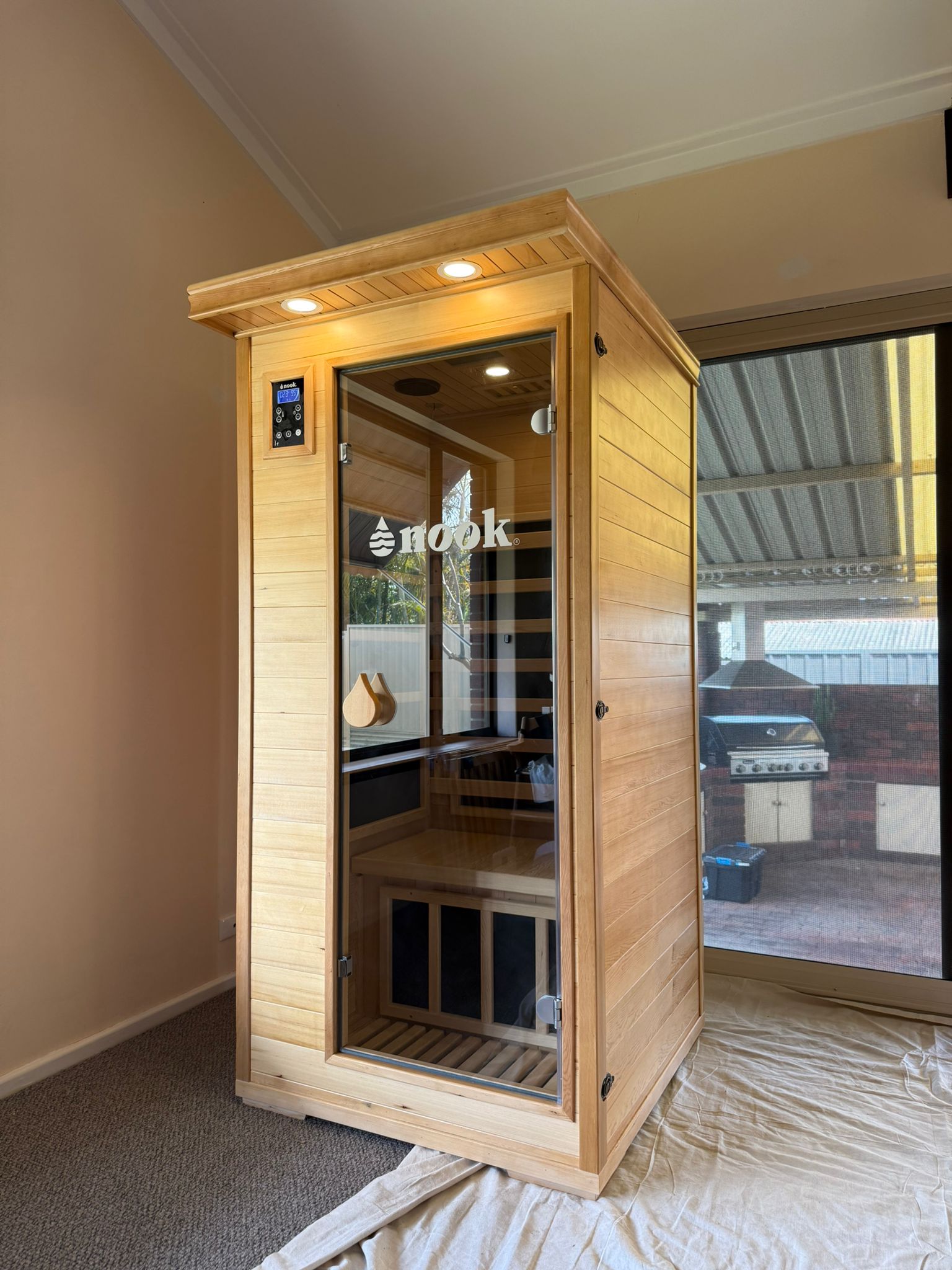 Nook Core 1-person infrared sauna installed in a home gym setup 