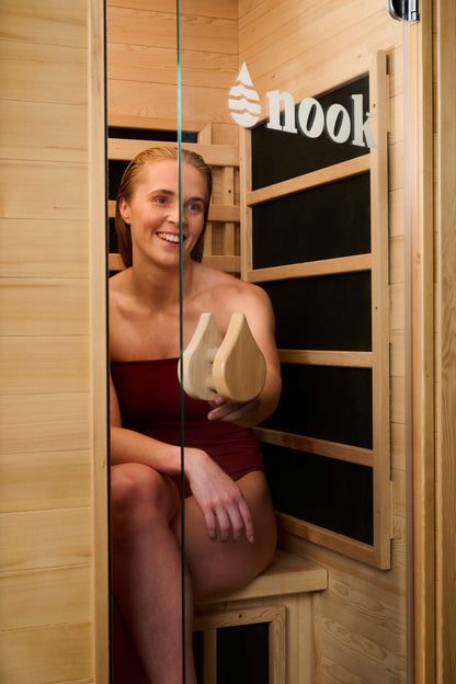 Person inside a Nook Core 1-person infrared sauna 