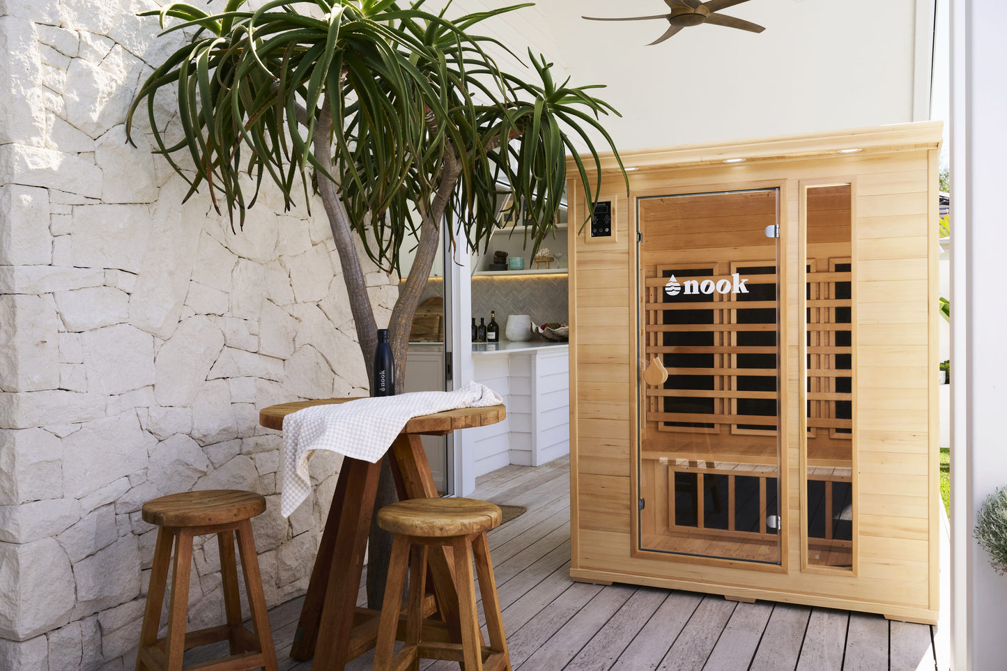 LIfestyle natural shot of the Nook Core 3-person sauna