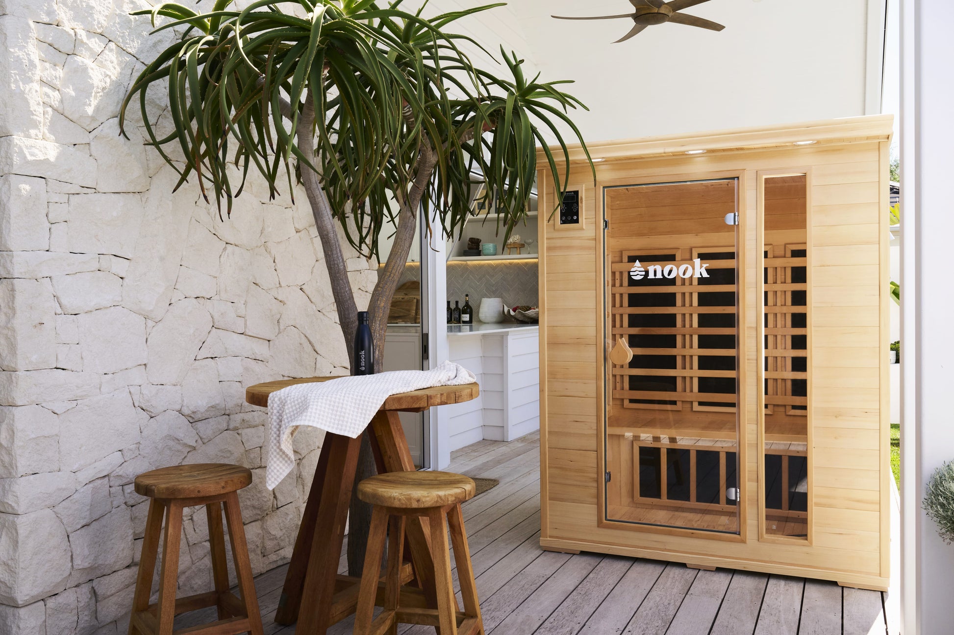 LIfestyle natural shot of the Nook Core 3-person sauna