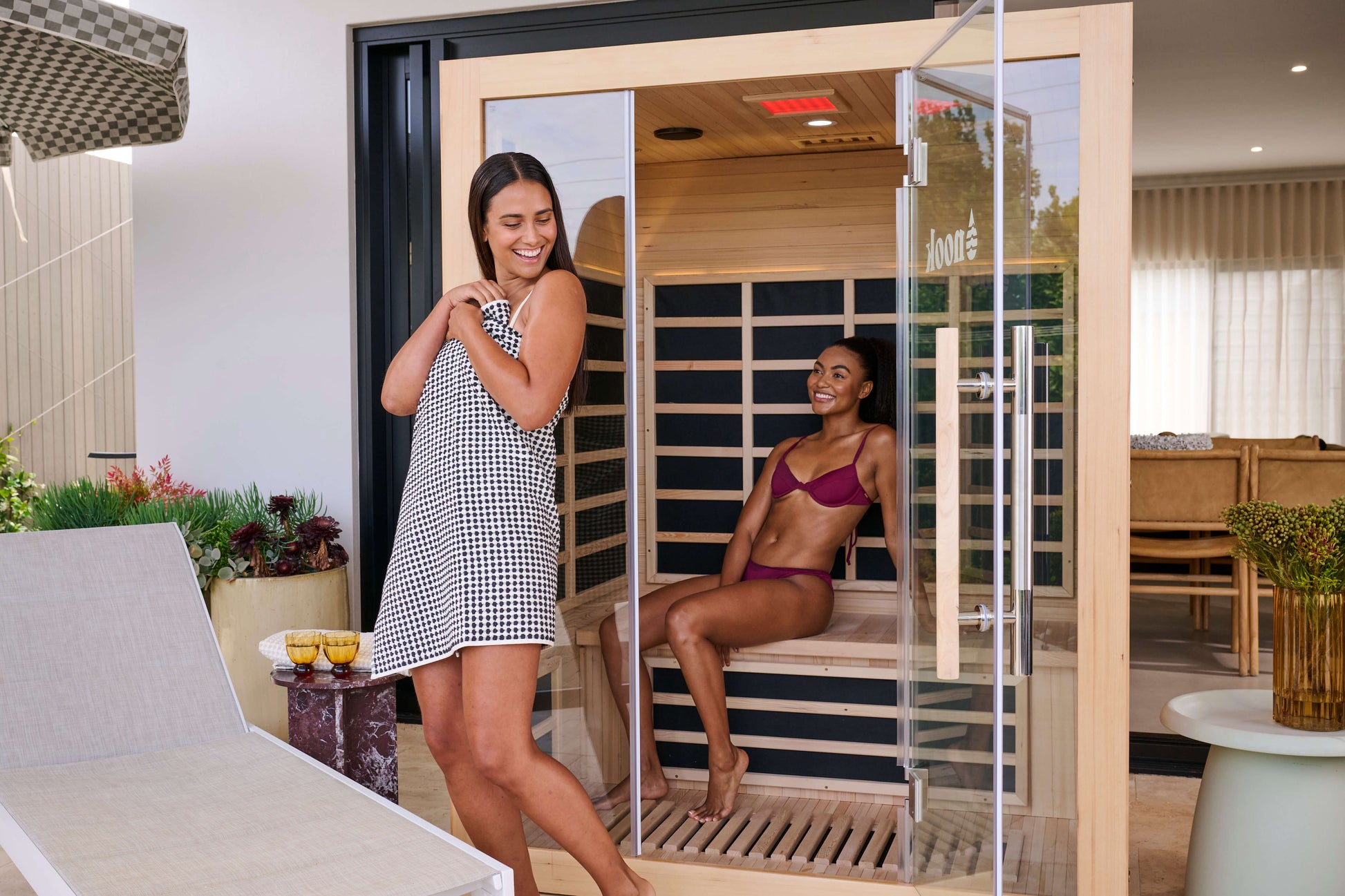 Group enjoying a Nook Elite 3-person infrared sauna