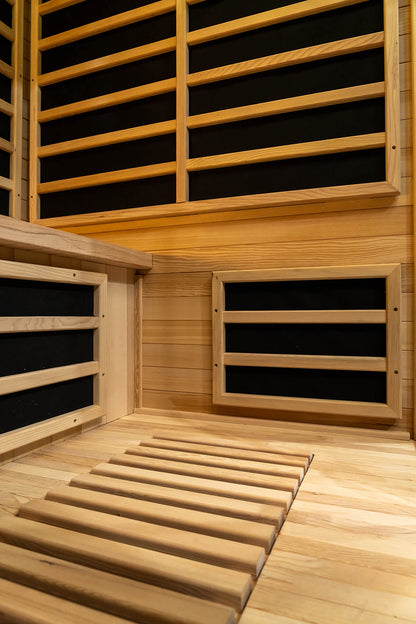 Interior hemlock wall panels corner shot inside a Nook Elite 3-person infrared sauna