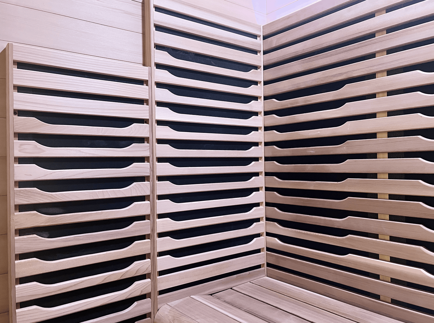 Interior Canadian Red Cedar wood details of a Nook Ultra 3-person infrared sauna