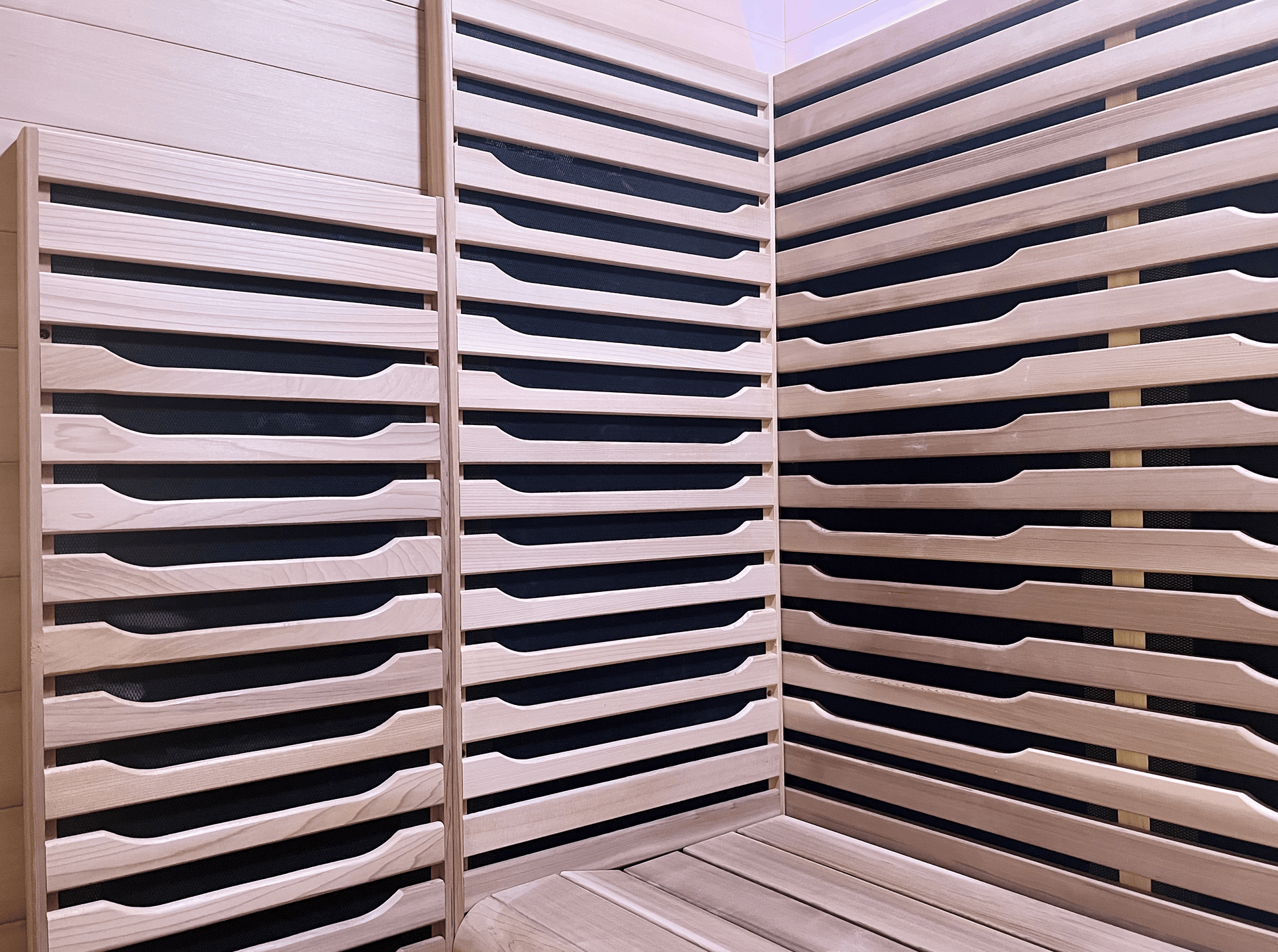 Interior Canadian Red Cedar wood details of a Nook Ultra 3-person infrared sauna